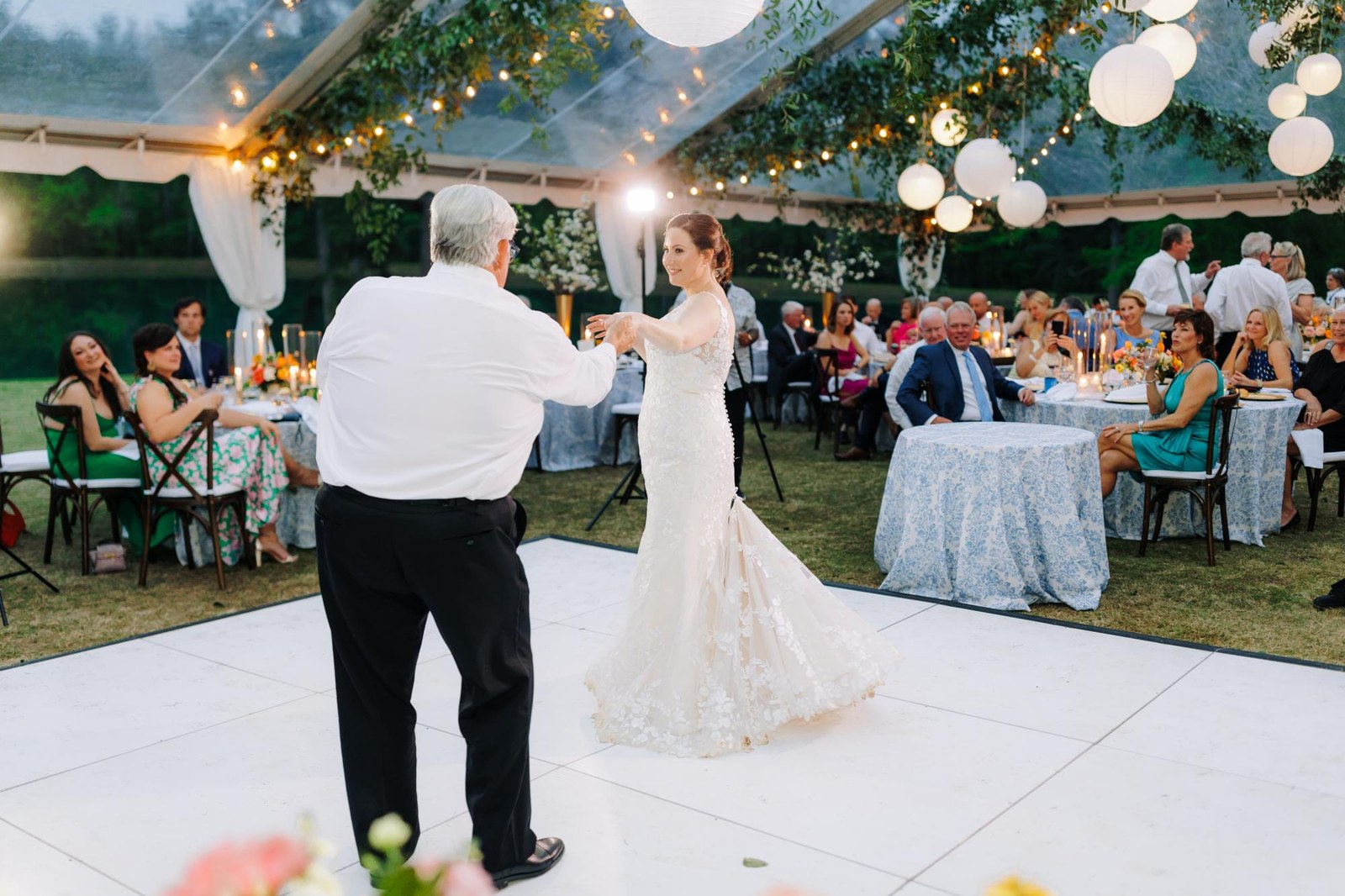 Solid black and white dance floor set up at a Denver wedding reception