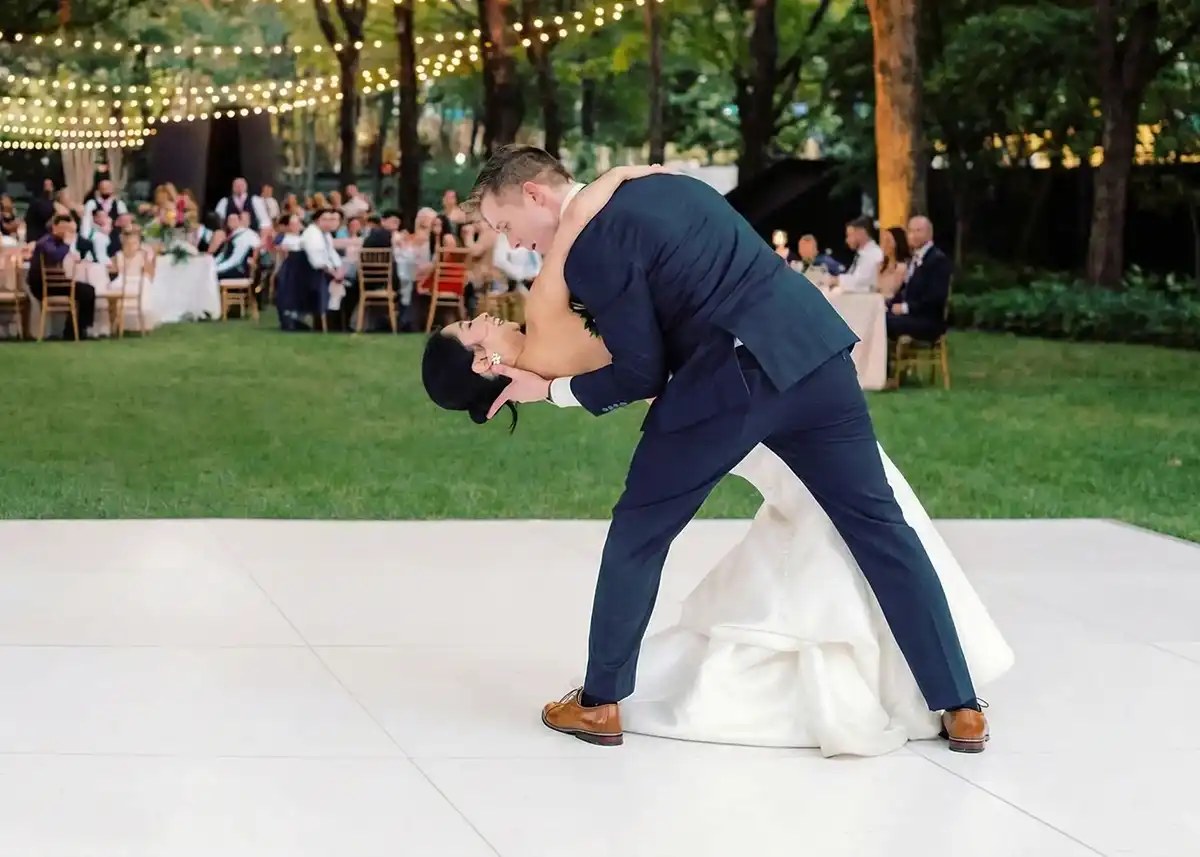 All white dance floor set up at an outdoor wedding reception near Denver